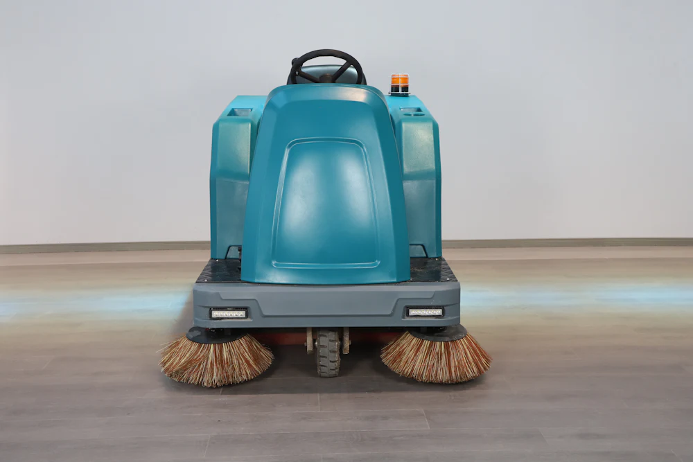 Ride-on floor scrubber for warehouse and industrial floors
